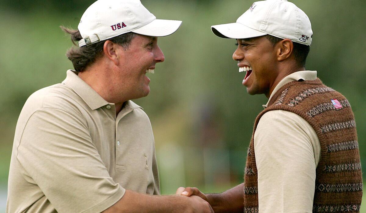 Phil Mickelson, left, and Tiger Woods were at the height of their dominance on the PGA Tour in 2006, when they shared a laugh during a practice round before Ryder Cup play that year.