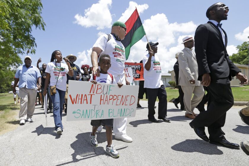 Protesters march from Waller County Jail to the Waller County Courthouse in Hempstead, Texas, on Friday to protest the death of Sandra Bland, who was found dead in a jail cell this week.