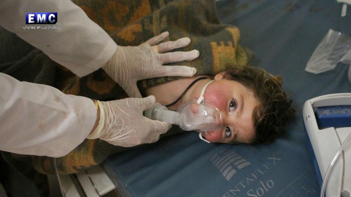 A Syrian doctor treats a child after a poison-gas attack in the town of Khan Sheikhoun. (Edlib Media Center)