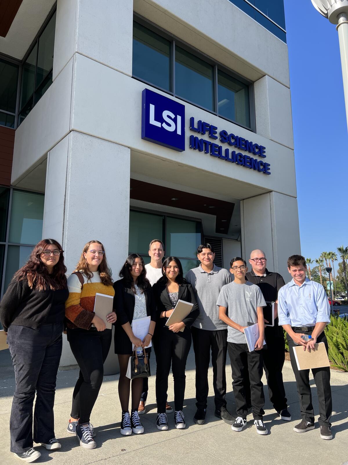 Ocean View High students are pictured with Life Science Intelligence CEO Scott Pantel outside the company headquarters.