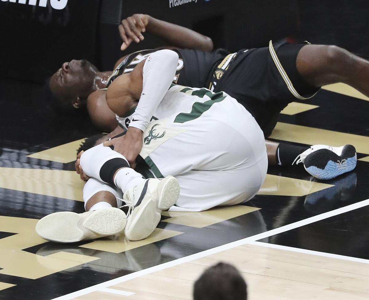 NBA: Giannis Antetokounmpo leaves game with knee injury