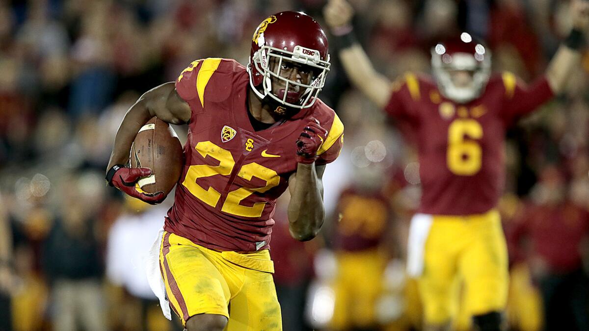 Trojans running back Justin Davis heads to the end zone during a 38-30 win over Arizona on Nov. 7.