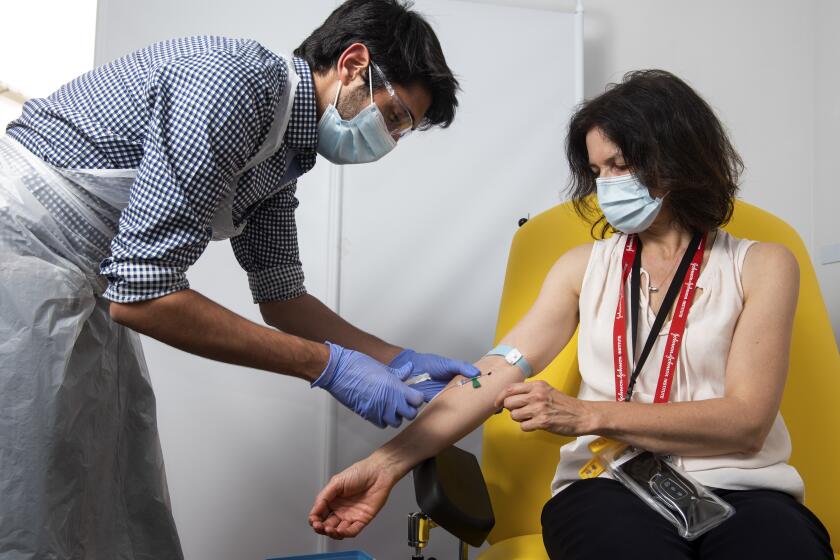 A doctor takes blood samples