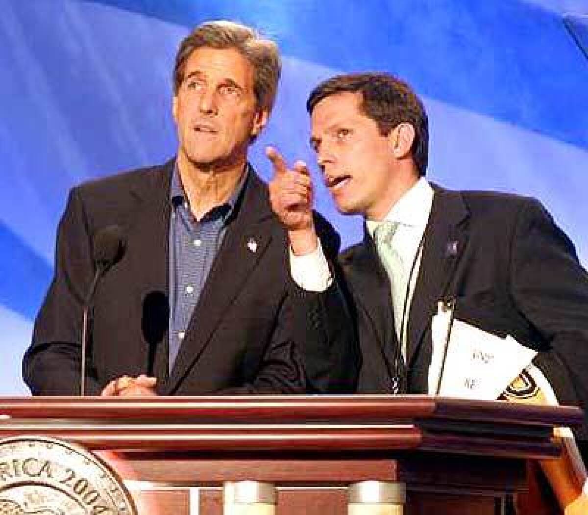 John Kerry and an aide check out the stage ahead of the candidate's big speech.