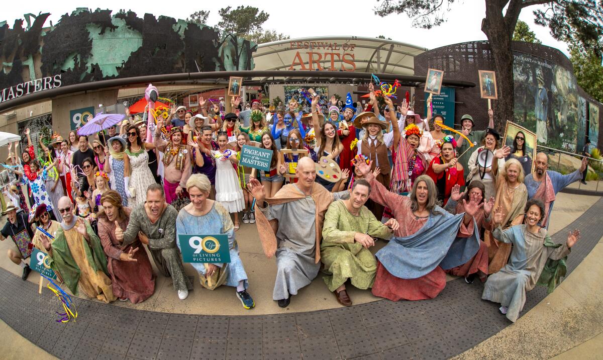 Parade participants gather in front of the Festival of Arts in Laguna Beach on Saturday.