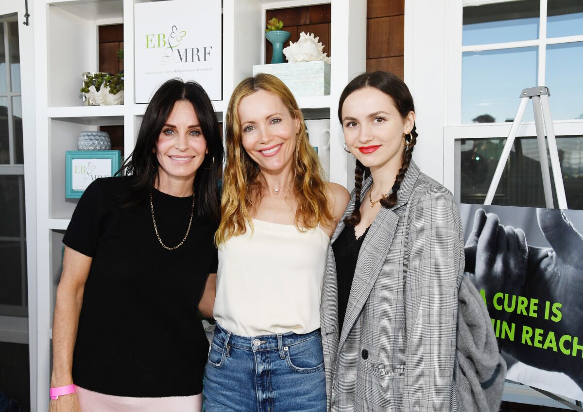 Courteney Cox, left, Leslie Mann and Maude Apatow atend the Rock4EB! event.