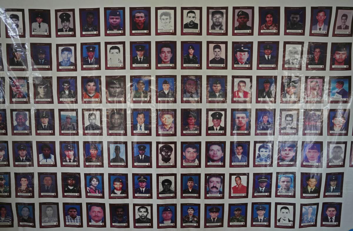 Rows of photos on a wall show people who disappeared during Colombia's internal conflict