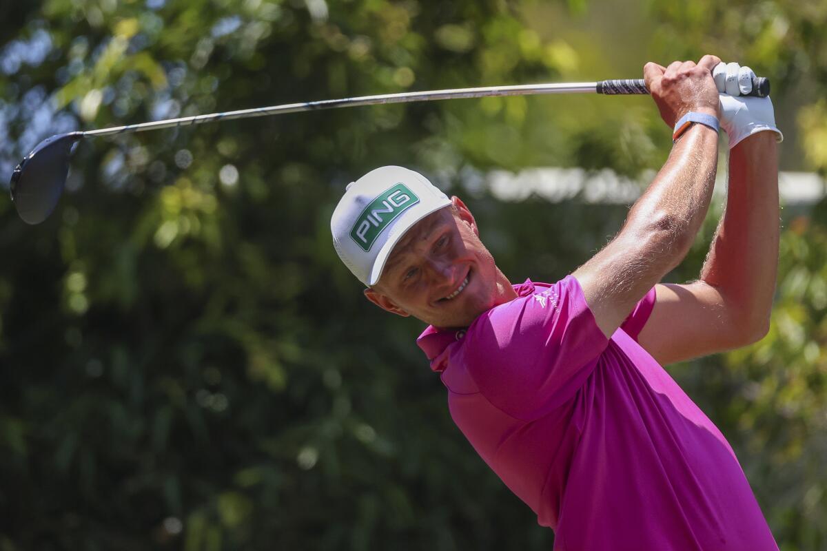 Poland's Adrian Meronk tees off on the second hole during the Australian Open golf championship at Victoria golf course in Melbourne, Australia, Sunday, Dec. 4, 2022. (AP Photo/Asanka Brendon Ratnayake)