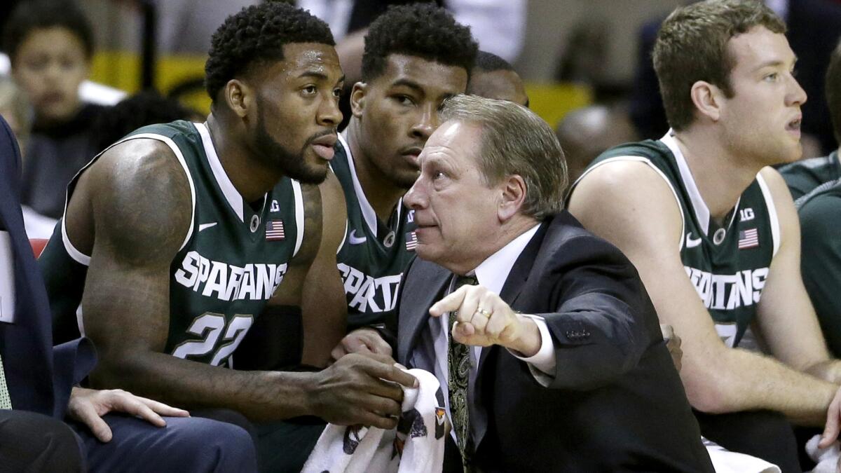 Michigan State Coach Tom Izzo speaks with Branden Dawson (22) during a game against Maryland on Jan. 17, 2015.