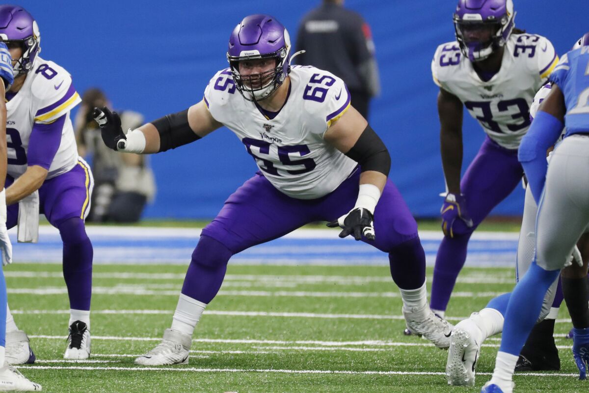 FILE - In this Oct. 20, 2019, file photo, Minnesota Vikings offensive guard Pat Elflein (65) defends during the first half of an NFL football game against the Detroit Lions, in Detroit. The Vikings had some trouble on the interior of their offensive line at times last season, and there were no upgrades made. Their first move to try to improve was to shift Pat Elflein from left guard to right guard. (AP Photo/Rick Osentoski, File)