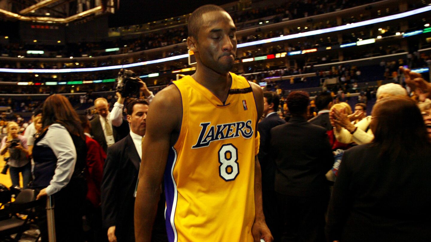 Lakers star Kobe Bryant tries to hide his emotions after the team's season-ending loss to the San Antonio Spurs in Game 6 of the 2003 NBA Western Conference semifinals.