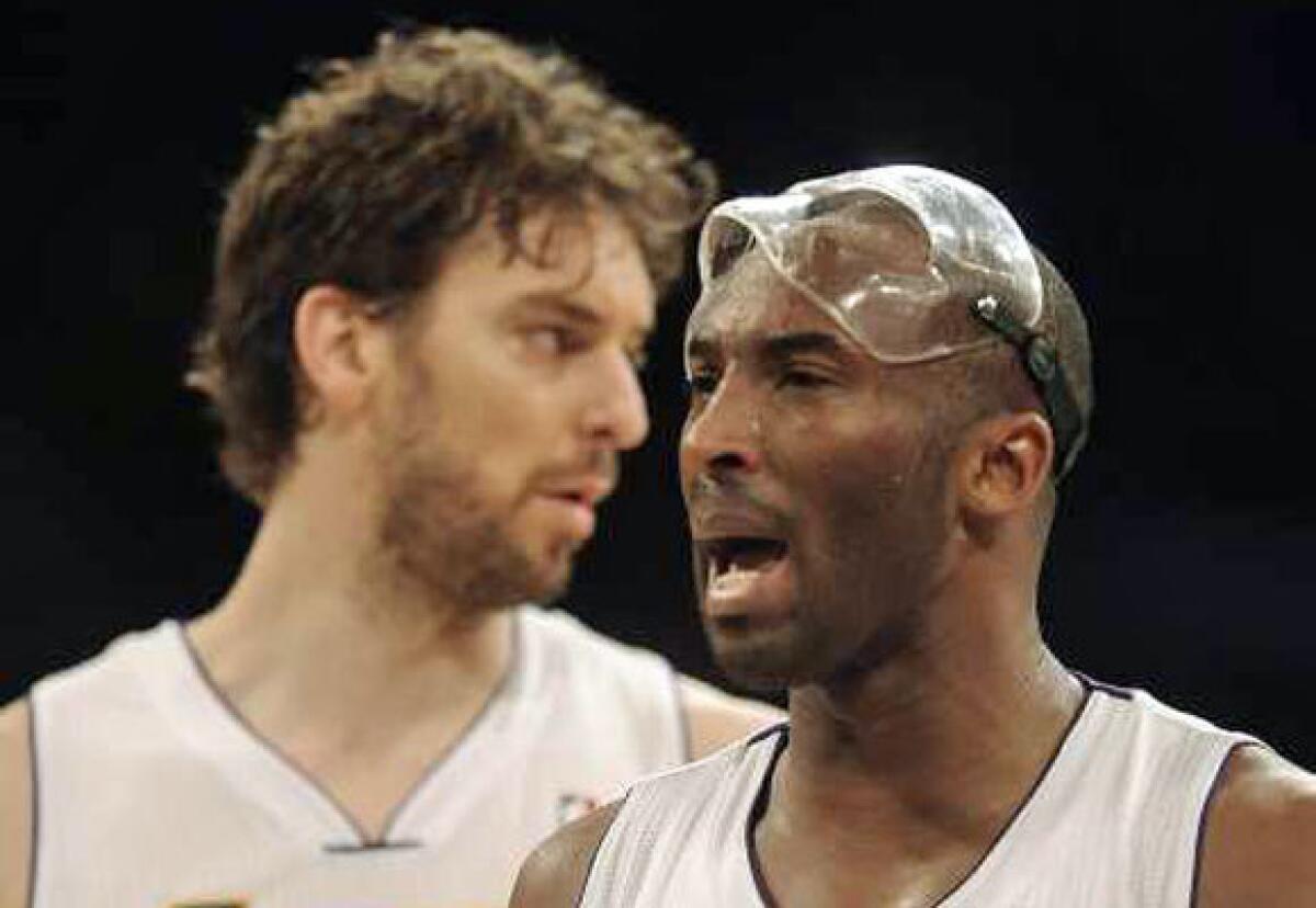Pau Gasol, left, and Kobe Bryant are impressed that Magic Johnson bought the Dodgers.