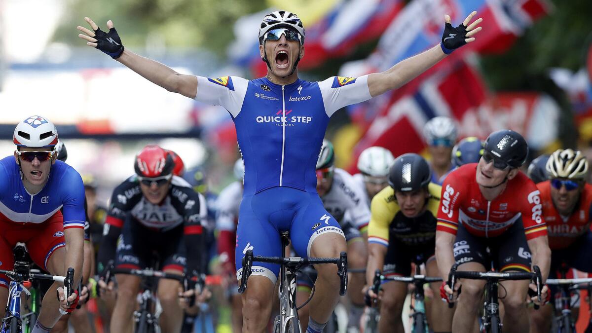 Marcel Kittel celebrates as he crosses the finish line to win the second stage of the Tour de France on Sunday.