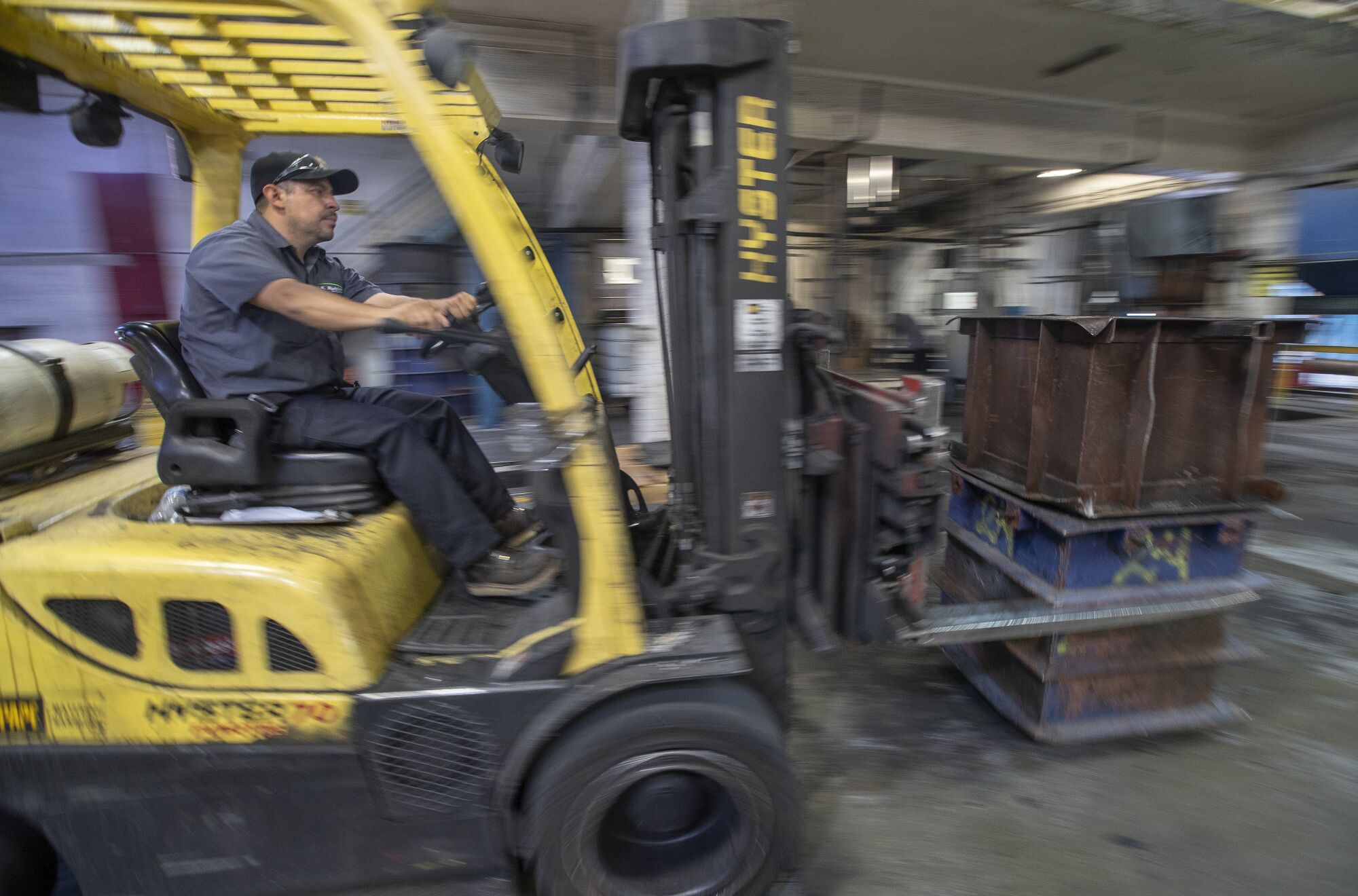 Carlos Arceo, 39, a 2nd shift manager at U.S. Rubber Recycling, operates a fork lift inside the production floor.