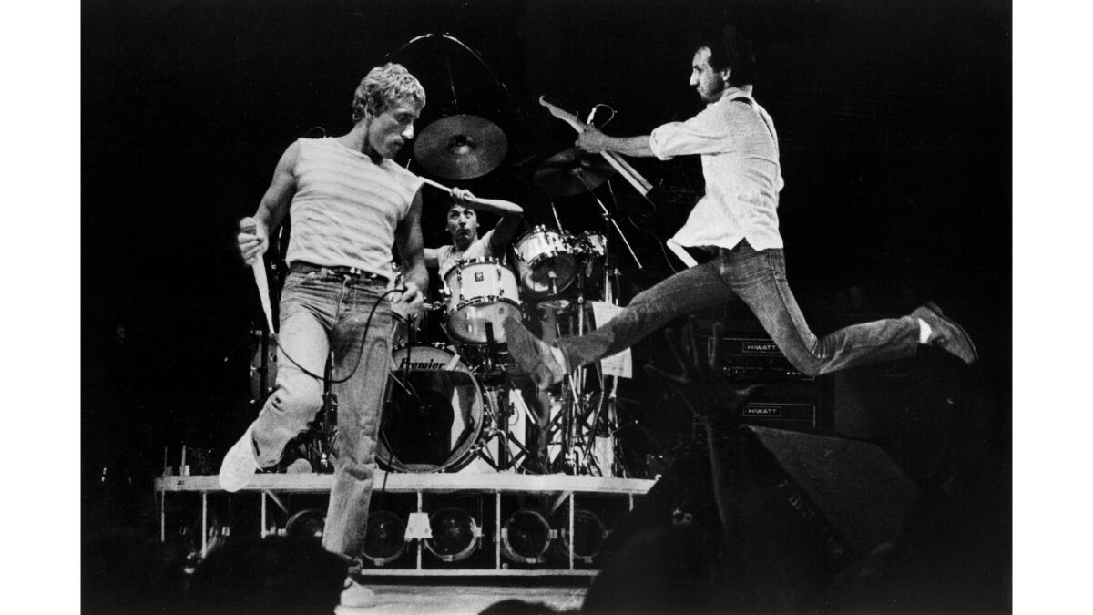 June 24, 1980: Singer Roger Daltrey, left, drummer Kenney Jones and guitarist Pete Townshend of the Who perform at the Los Angeles Sports Arena.