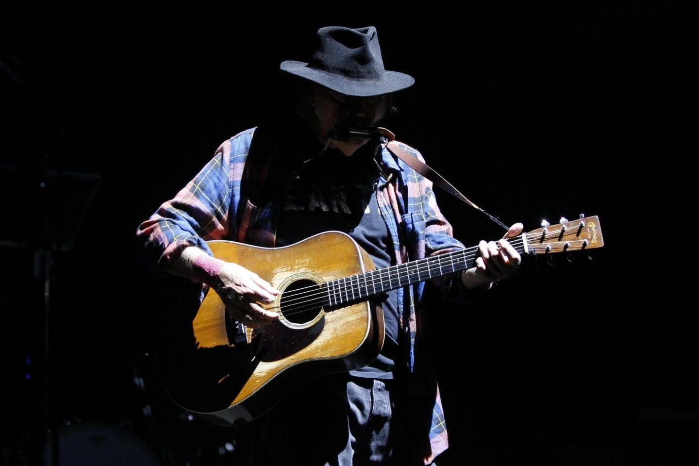 Neil Young performs at the RIMAC Arena.