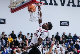 Dominique Bentho with a dunk for Harvard-Westlake against Crespi.