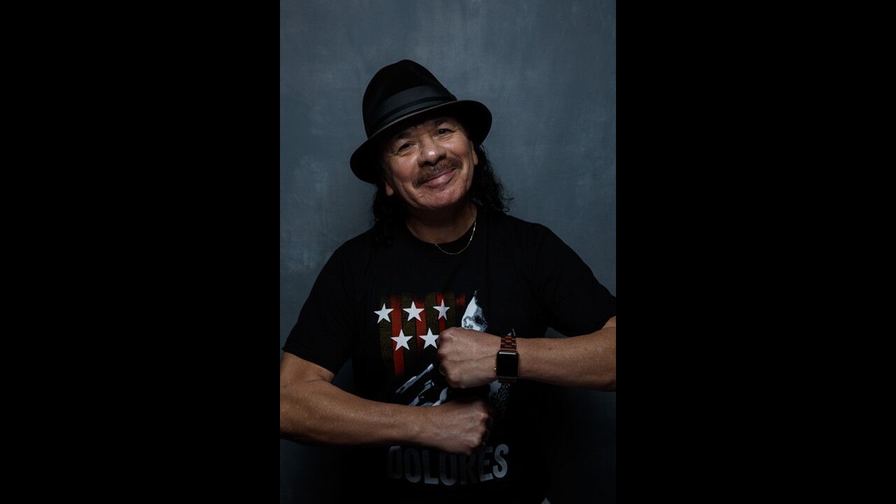 Producer Carlos Santana with the film "Dolores."