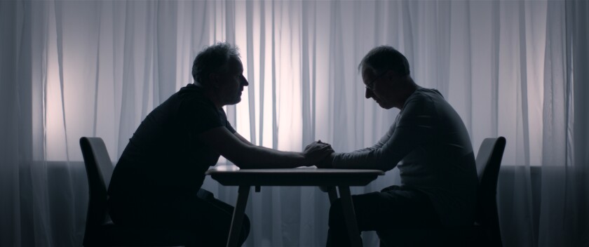 Twins Marcus, left, and Alex Lewis embrace after an intimate confession in the documentary “Tell Me Who I Am.”