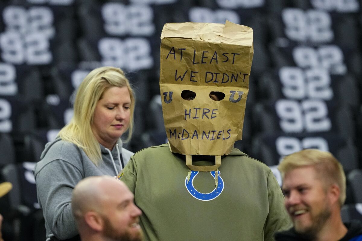 A Indianapolis Colts fan wears a paper sack over his head before a game against the Las Vegas Raiders
