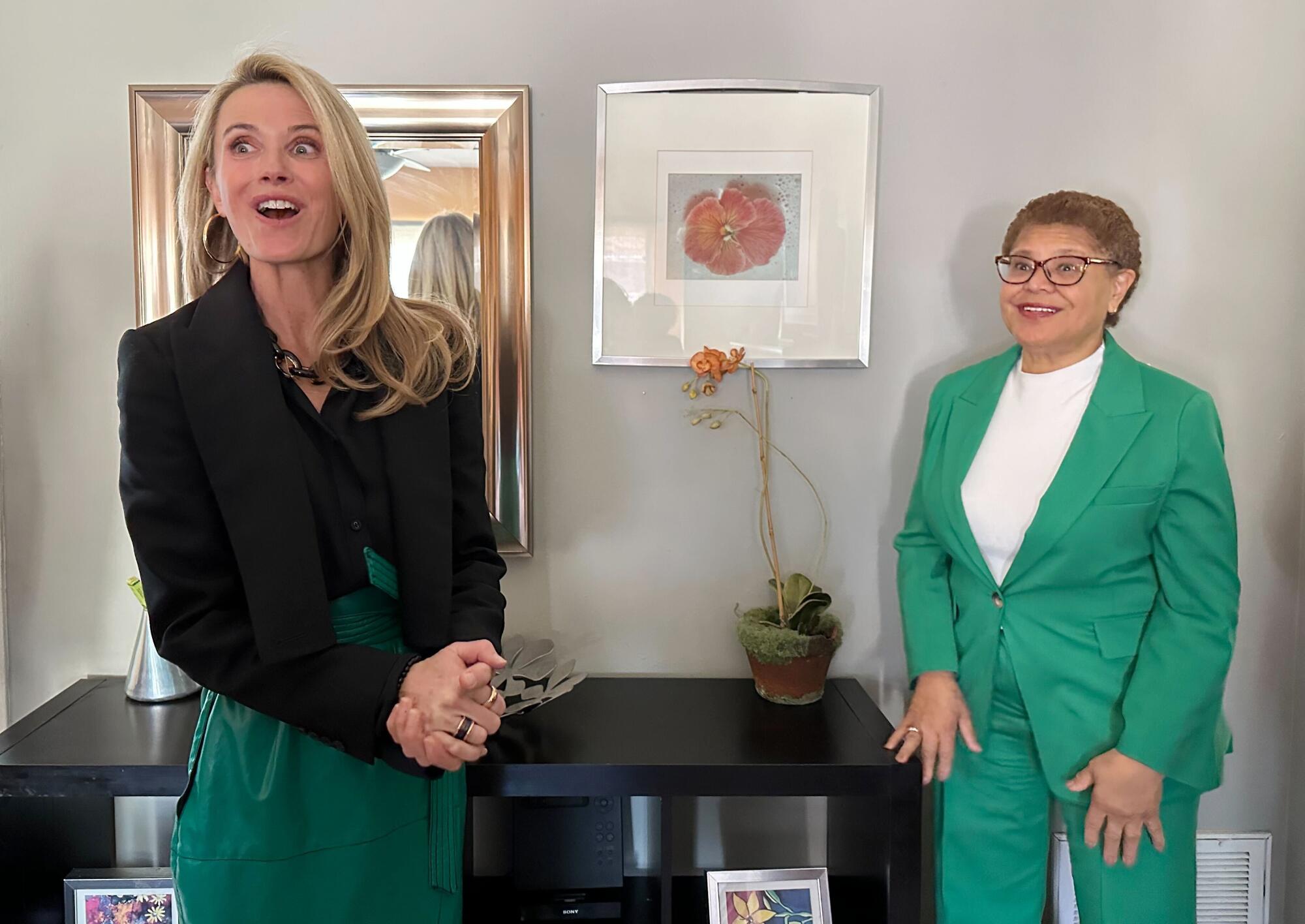 Jennifer Siebel Newsom and Los Angeles Mayor Karen Bass standing in a brightly lit room with art on the wall