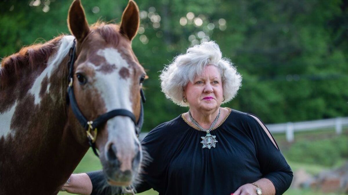 Ann Jones is an equine professional and cattle rancher with property in Georgia and Oklahoma. She's shown here with one of her favorite horses, Delta, on her farm, Jones Cutting Horses, in Flowery Branch, Ga.