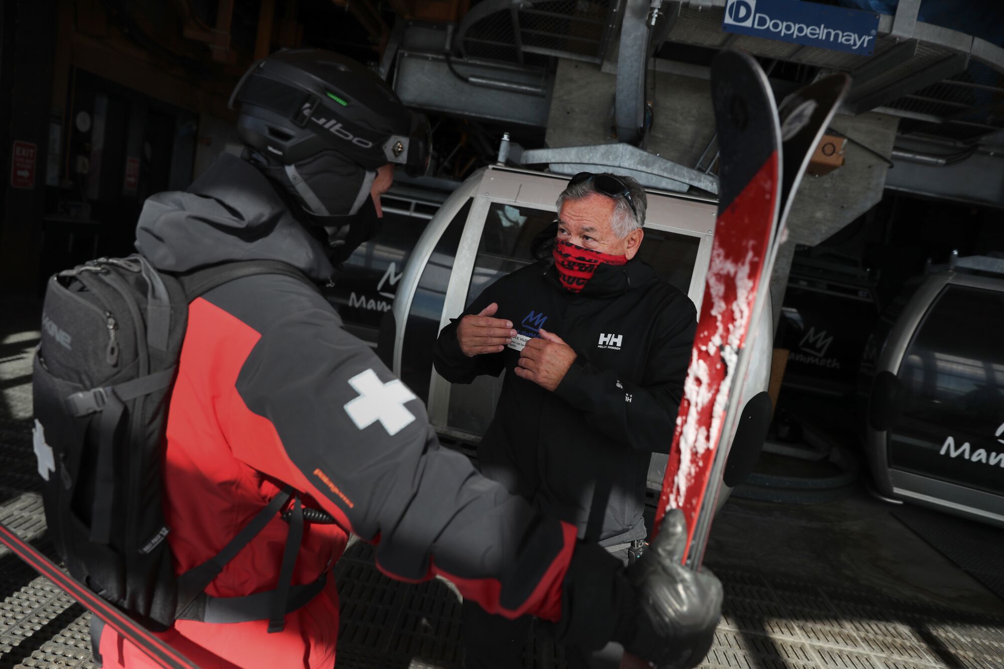 Valencia confers with a ski patrolman