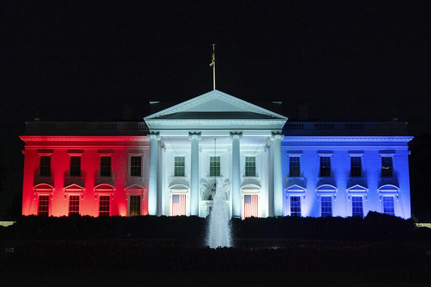 The White House is lit with the colors of the American flag to support team USA competing in the Paris Olympics, on Monday, July 29, 2024, in Washington. Former Presidents Barack Obama and George W. Bush will join an effort to commemorate America's 250th anniversary in 2026, highlighting the initiative's attempts to build bipartisan momentum in an era of extreme political polarization. The former presidents and first ladies Michelle Obama and Laura Bush will serve as honorary national co-chairs of America250, the organization created by Congress in 2016 to oversee the celebration of the the 250th anniversary of the signing of the Declaration of Independence. (AP Photo/Jose Luis Magana)