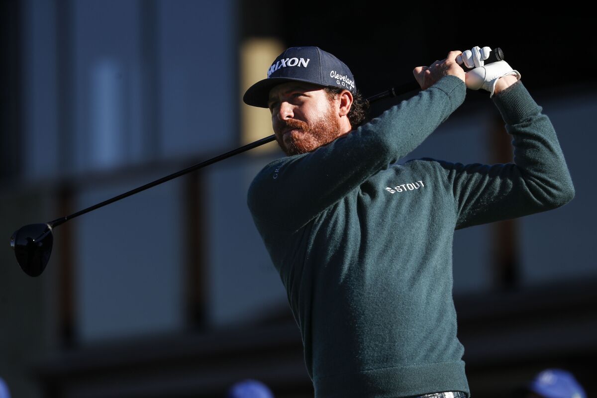 Sam Ryder tees off during the first round of the Farmers Insurance Open at Torrey Pines Golf Course in La Jolla.