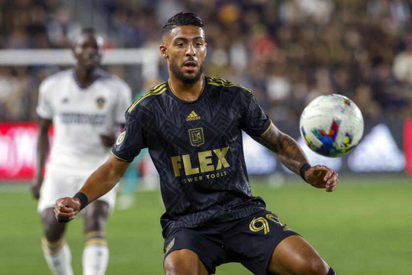 LAFC forward Denis Bouanga controls the ball during a match against the Galaxy in October 2022.