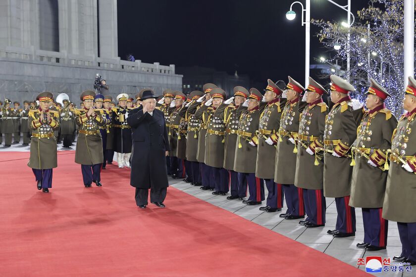 In this photo provided by the North Korean government, North Korean leader Kim Jong Un, center, acknowledges military top officials during a military parade to mark the 75th founding anniversary of the Korean People’s Army on Kim Il Sung Square in Pyongyang, North Korea Wednesday, Feb. 8, 2023. Independent journalists were not given access to cover the event depicted in this image distributed by the North Korean government. The content of this image is as provided and cannot be independently verified. Korean language watermark on image as provided by source reads: "KCNA" which is the abbreviation for Korean Central News Agency. (Korean Central News Agency/Korea News Service via AP)
