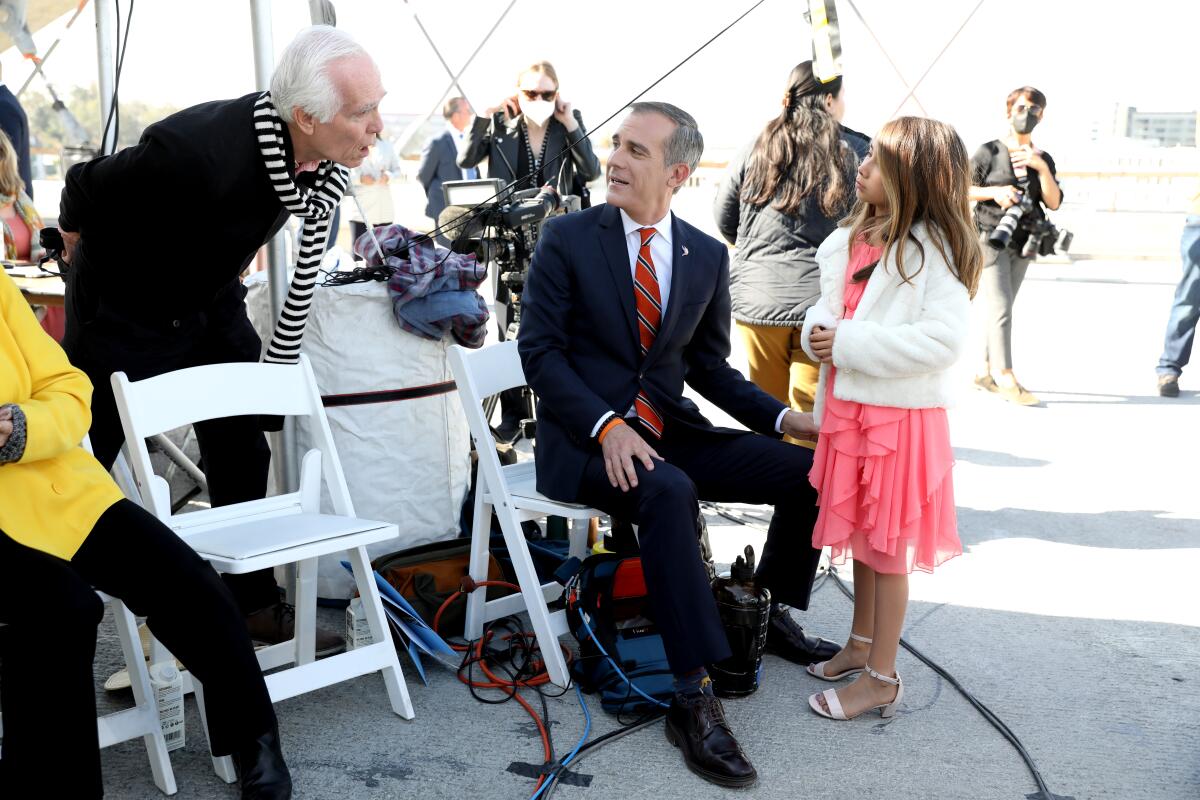Los Angeles Mayor Eric Garcetti, center, with father Gil Garcetti, left, and a guest, before Mayor Garcetti speech.