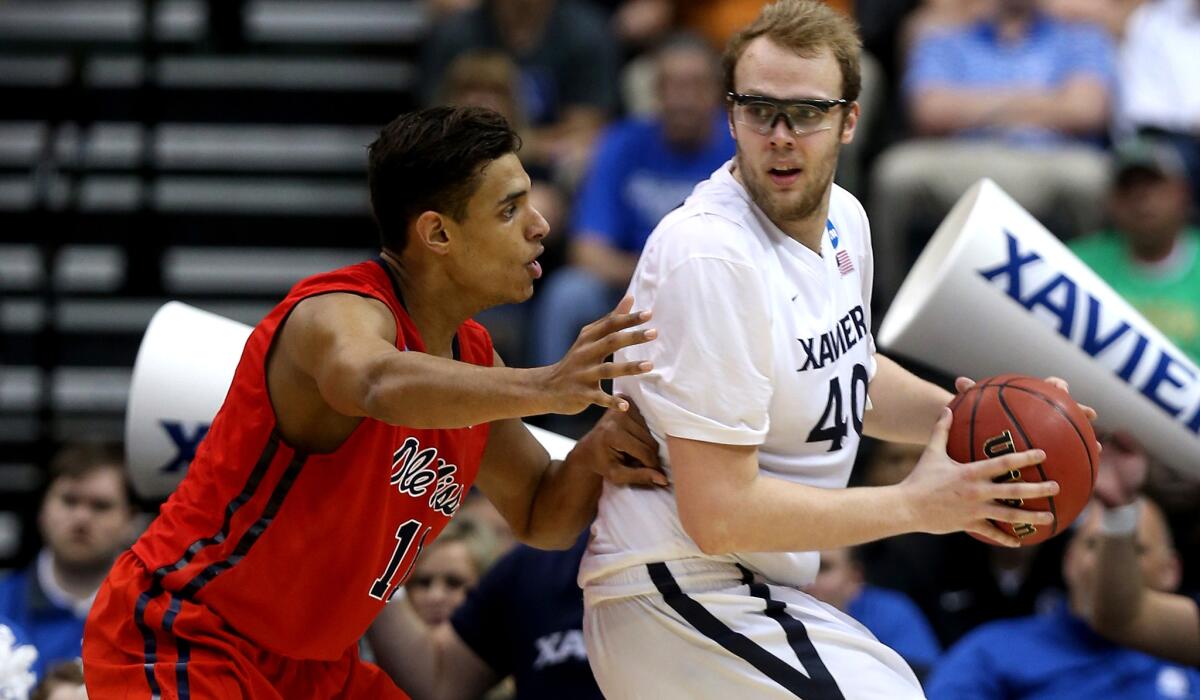 Xavier center Matt Stainbrook, who finished with 20 points and nine rebounds, works in the post against Mississippi forward Sebastian Saiz in the second half of a 76-57 victory Thursday in Jacksonville, Fla.