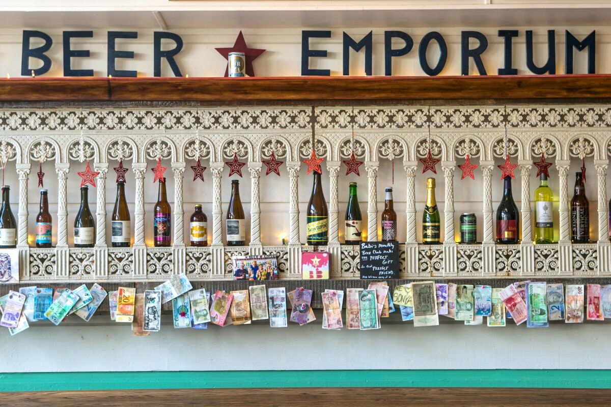 "Beer Emporium" signage with many beer selections