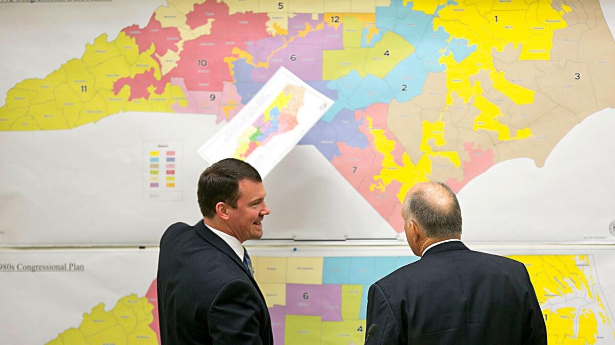 Republican state Sens. Dan Soucek, left, and Brent Jackson review historical maps during the Senate Redistricting Committee for the 2016 extra session of the North Carolina state legislature in Raleigh, N.C., on Feb. 16, 2016.