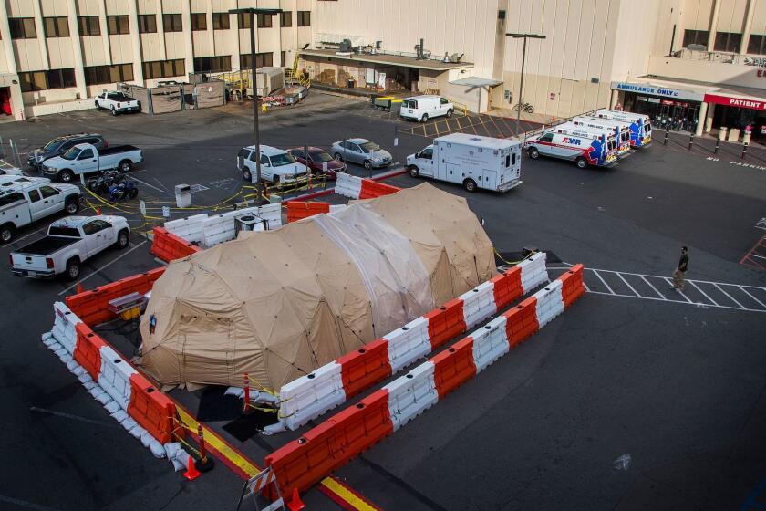 LOMA LINDA, CA - JANUARY 16, 2018: A military grade medical tent is set up in the parking lot and used for overflow flu patients outside the Emergency Room at Loma Linda Medical Center on January 16, 2018 in Loma Linda, California. (Gina Ferazzi / Los Angeles Times)