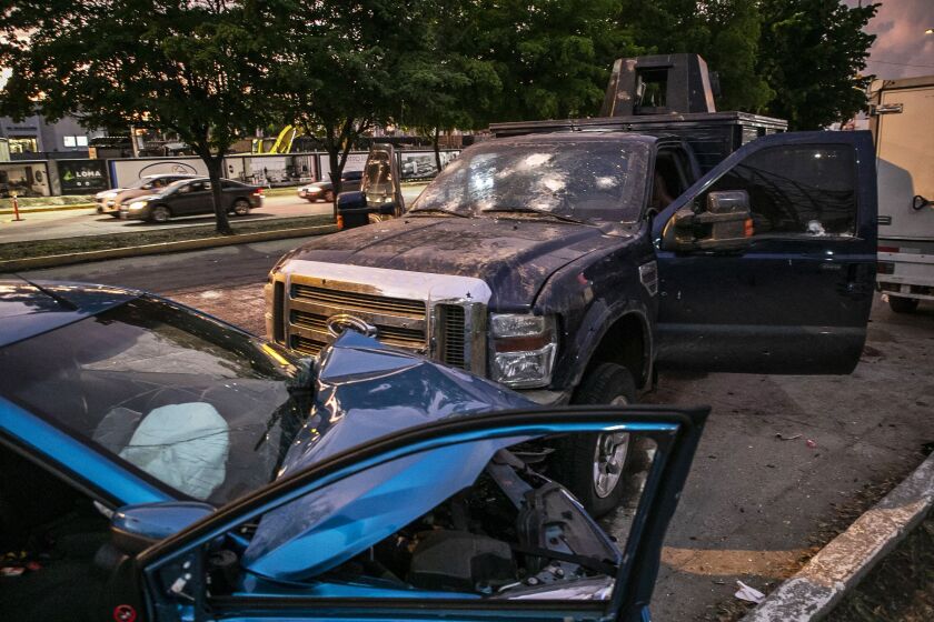 Vehicles are riddled with bullet holes after the battle. 