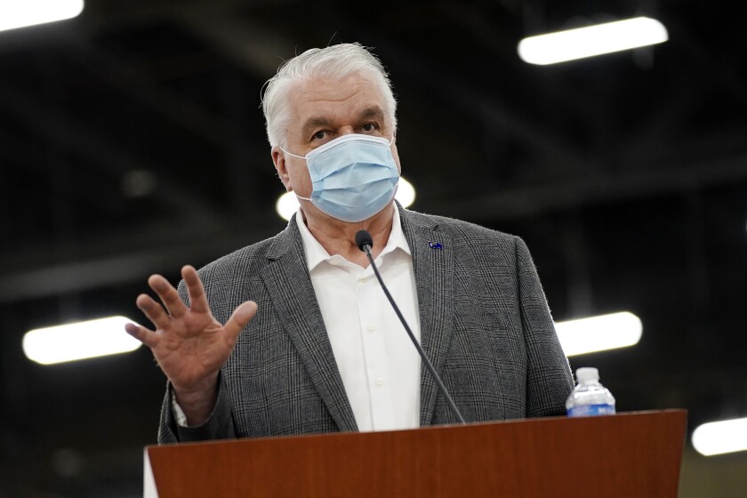 FILE - In this April 29, 2021, file photo, Nevada Gov. Steve Sisolak speaks during a news conference in Las Vegas. Gov. Sisolak applauded Nevada lawmakers for passing hundreds of bills in a legislative session colored heavily by the coronavirus pandemic. In an interview with reporters Tuesday, June 1, 2021, Sisolak said he felt optimistic about the state's future. (AP Photo/John Locher, File)