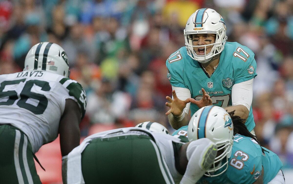 Miami Dolphins quarterback Ryan Tannehill calls out instructions for his teammates during a game against the New York Jets at London's Wembley Stadium on Oct. 4.
