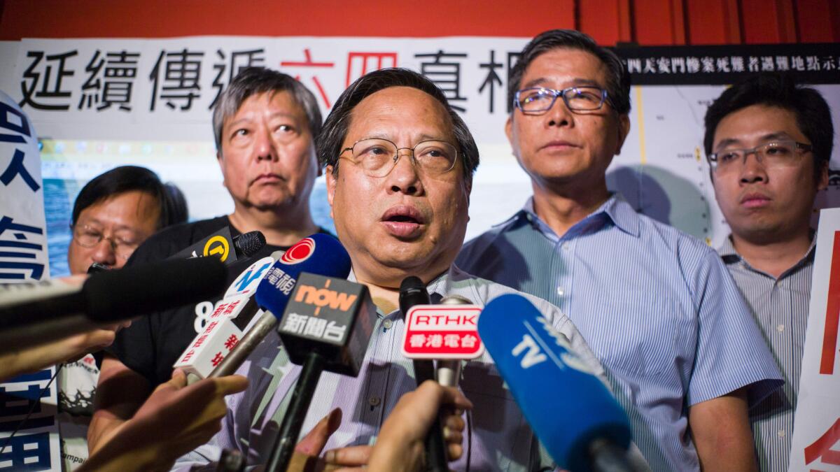 Pro-democracy politician Albert Ho, center, and other members hold a news conference in the world's first museum dedicated to the 1989 Tiananmen Square crackdown, on its closing day in Hong Kong on July 11, 2016.