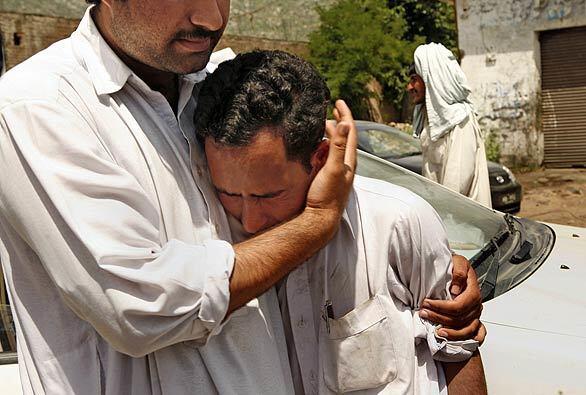 Grieving in Ambela, Pakistan