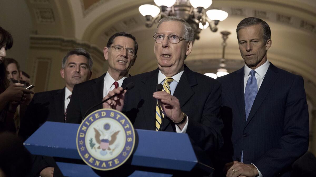 Senate Majority Leader Mitch McConnell (R-Ky.), flanked by Sen. Cory Gardner (R-Colo.), Sen. John Barrasso (R-Wyo.) and Sen. John Thune (R-S.D.), speaks to the media about the recent spending bill that averted a government shutdown. (Aaron P. Bernstein / Getty Images)