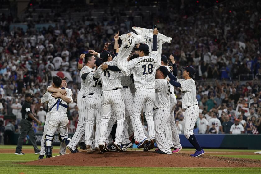 Japan celebrates after winning the World Baseball Classic final game against the U.S., Tuesday, March 21, 2023, in Miami. (AP Photo/Marta Lavandier)