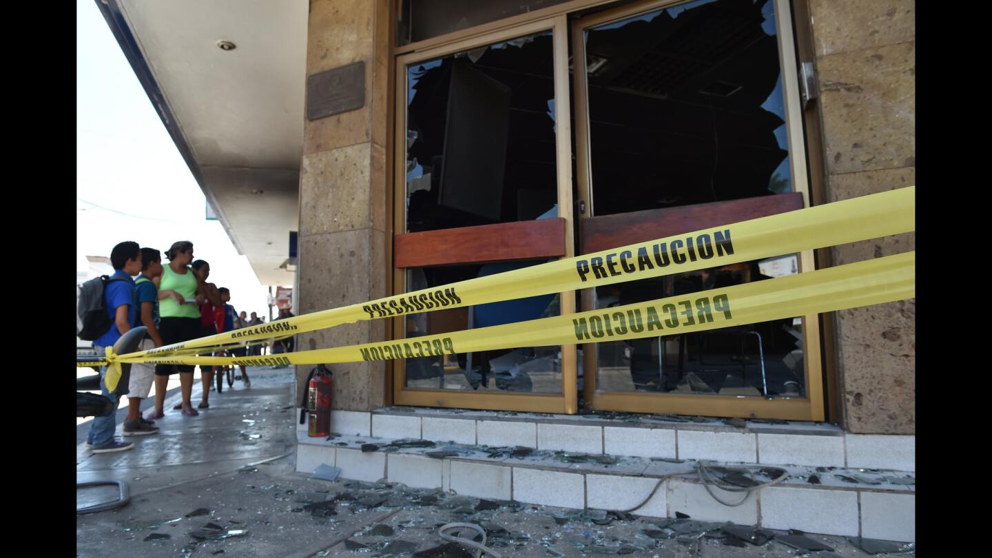 In Mexico's Jalisco state, a day of mayhem by drug traffickers on May 1 included the burning of banks and gasoline stations and the erecting of nearly 40 roadblocks using flaming vehicles. Above, a branch of Banamex in the city of Autlan a day after the attack.