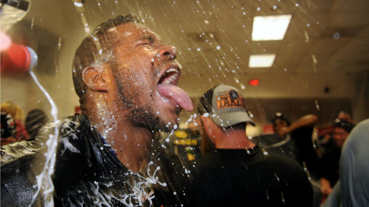 Dodgers Yasiel Puig celebrates in the locker room at Chase Field iafter defeating the Diamondbacks in Game 3 of the NLDS.