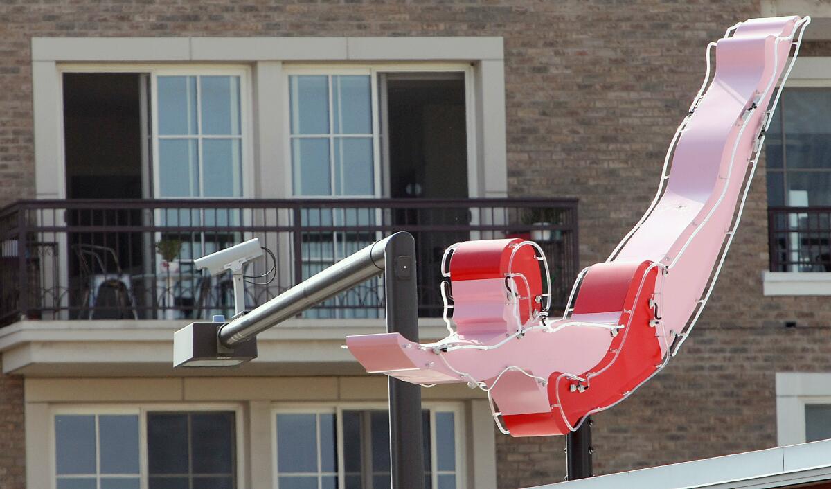 A new neon installation appears to be taking a dive off of the top of the Museum of Neon Art building under construction on Brand Blvd.