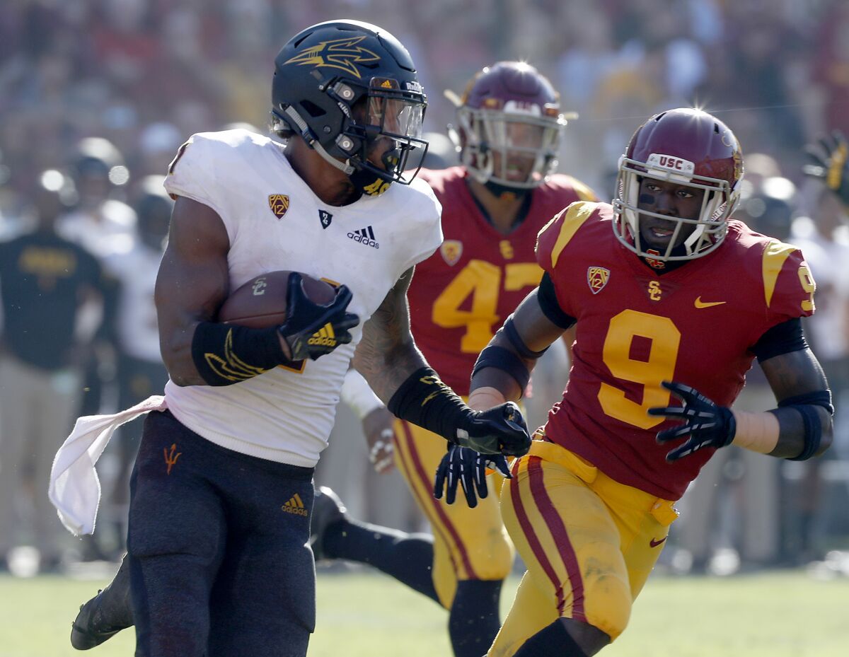 Arizona State's N'Keal Harry returns a punt for a touchdown against the Trojans in the third quarter quarter.