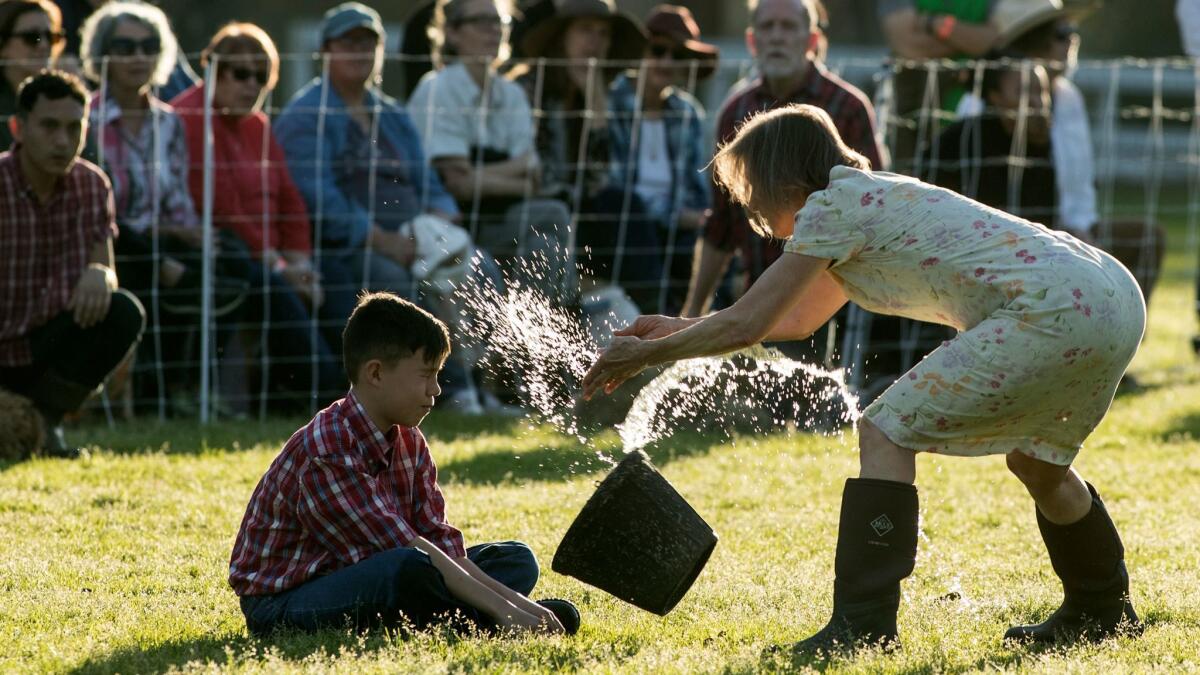 Imre Hunter gets splashed by Diane Frank.