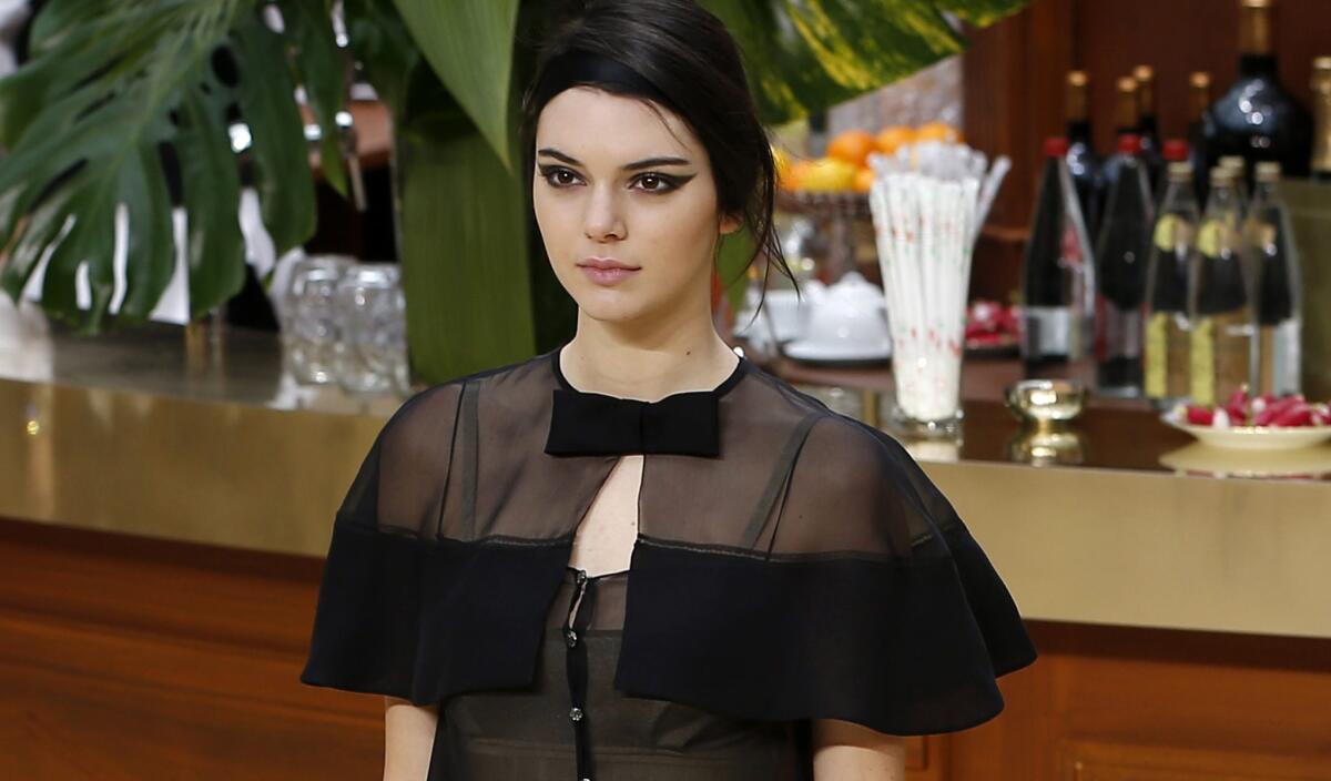 Kendall Jenner, shown walking in Karl Lagerfeld's Chanel presentation in Paris on March 10, accused an outlet of fabricating quotes and attributing them to her.