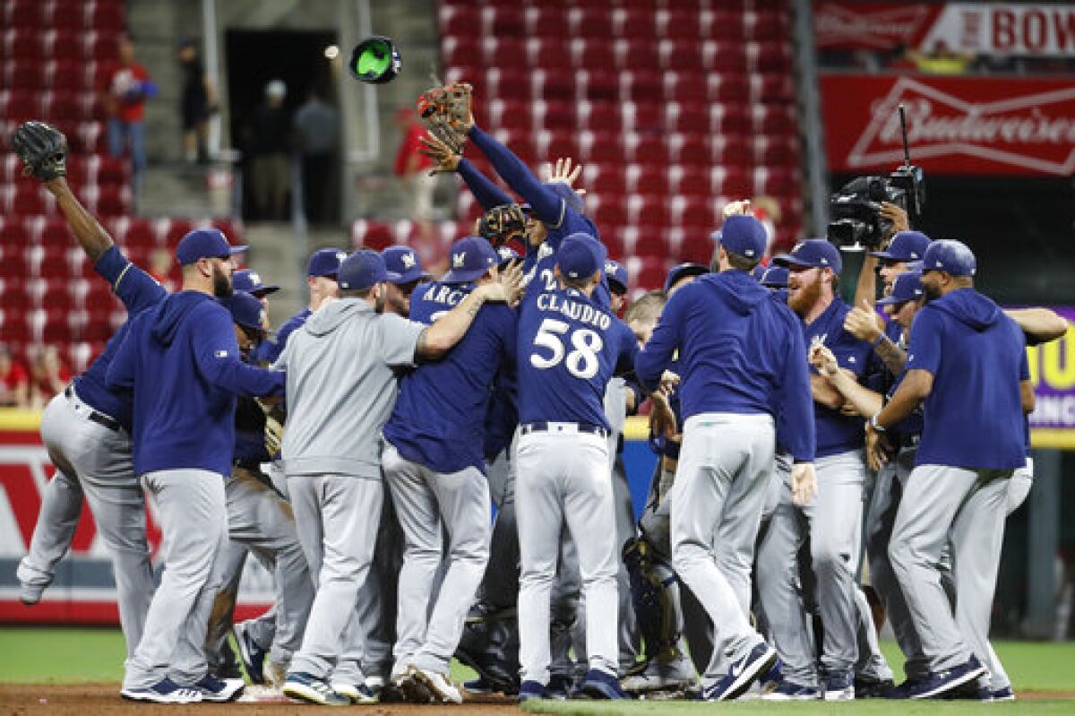 Christian Yelich powers up as Brewers explode to clinch playoff berth 